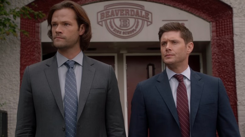 Sam and Dean standing side by side