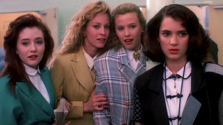 Veronica stands with the Heathers