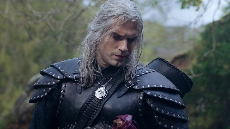 Geralt holding flower