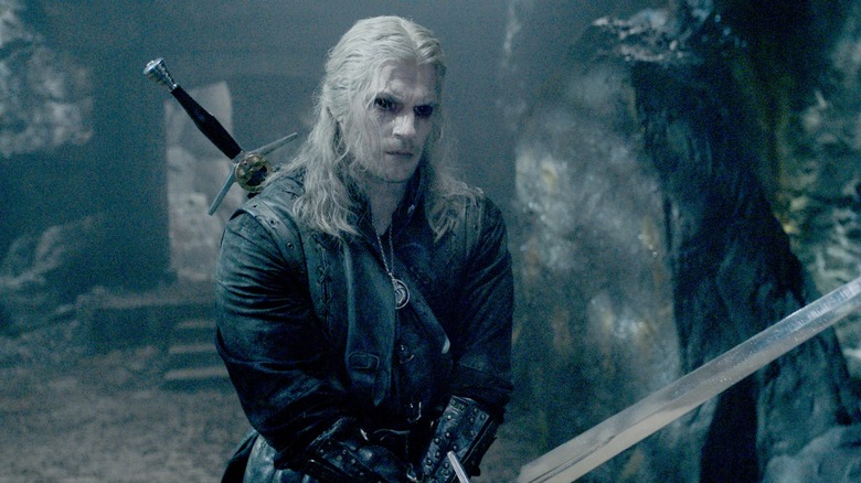 Black-eyed Geralt holding a sword