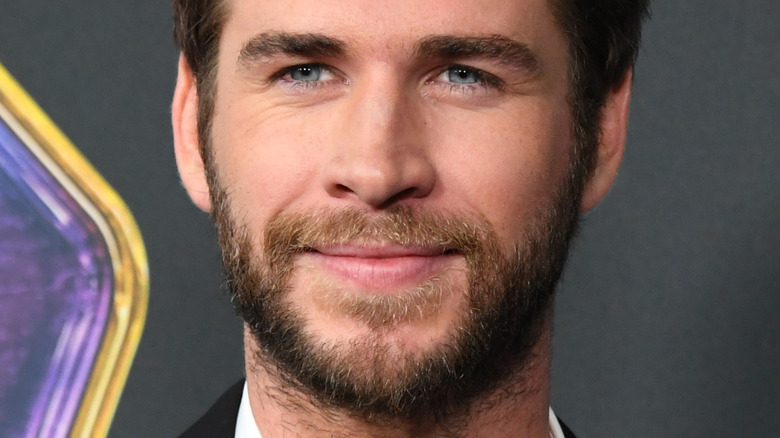 Liam Hemsworth on the red carpet with a beard