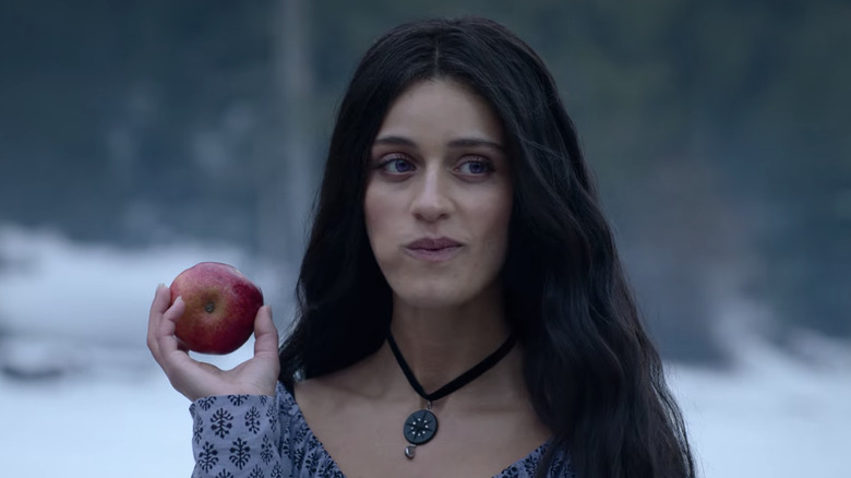 Yennefer eating an apple and smiling