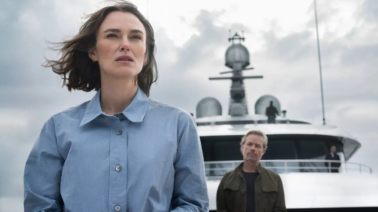 Lo and Richard standing on ship in The Woman in Cabin 10
