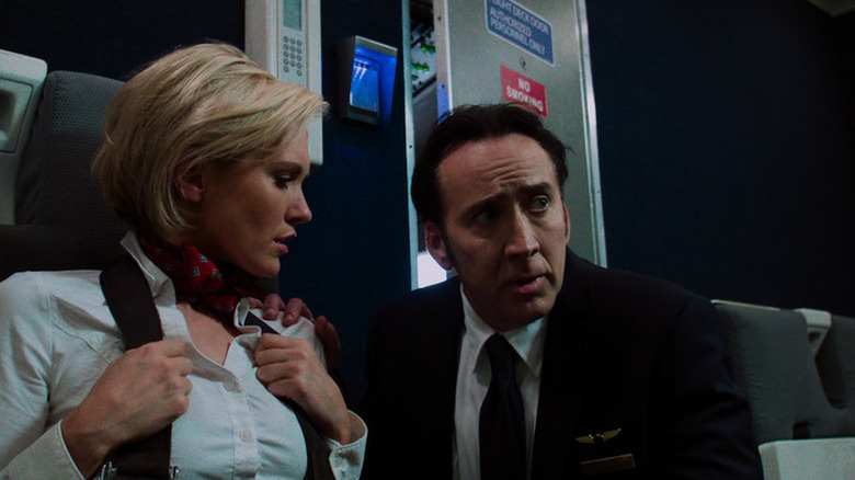 Nicolas Cage and an actress in Left Behind