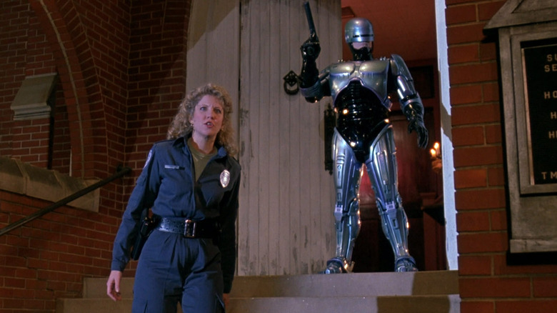 Robocop standing with an actress in Robocop 3