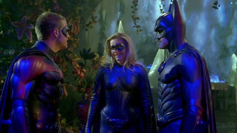 Robin, Batgirl, and Batman smiling together in Batman & Robin (1997)