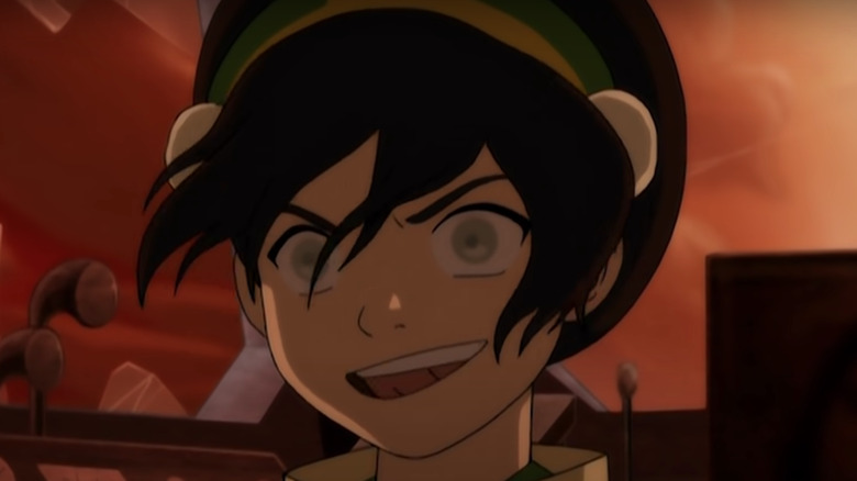 Toph smiling mischievously