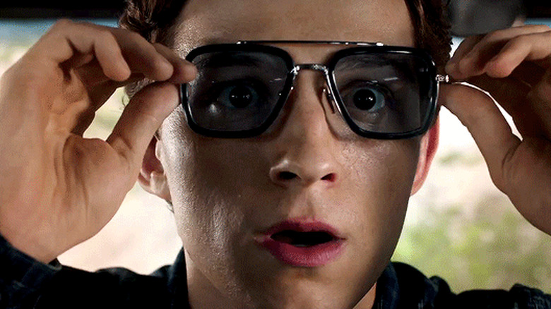 Peter holds his glasses