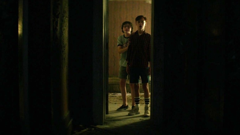 It kids stare through door