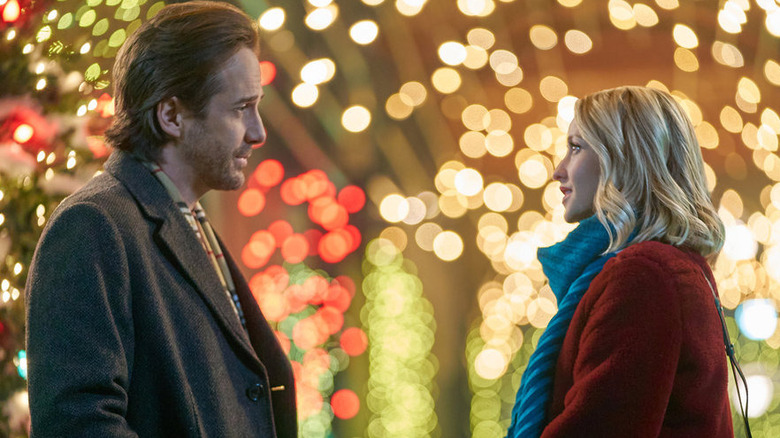 Man and woman with Christmasy background