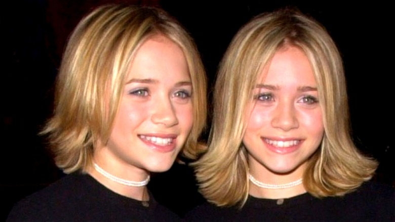 Mary-Kate and Ashley Olsen smiling