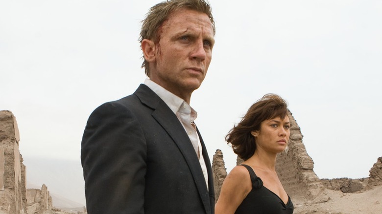 Bond and Camille walk through a desert
