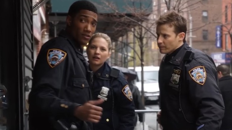 Vanessa Ray, Will Estes, and Carter Redwood discussing a robbery