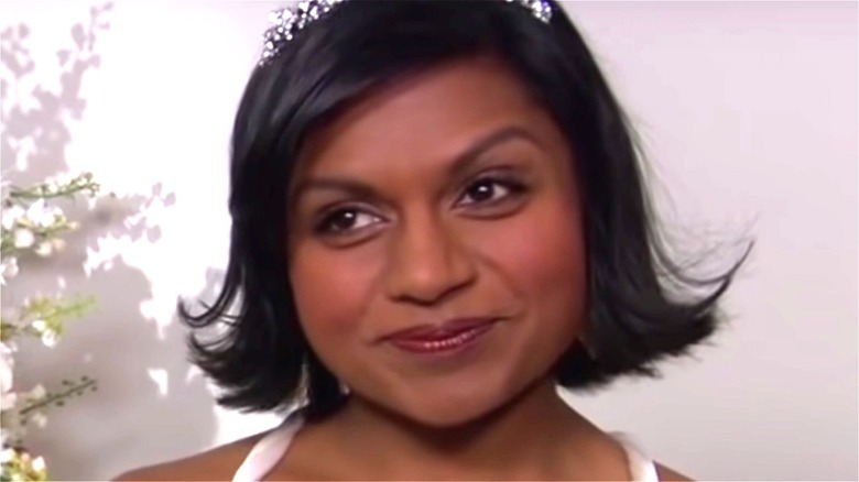Kelly Kapoor with a mischievous smile