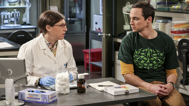 Amy in her lab looking at Sheldon on The Big Bang Theory