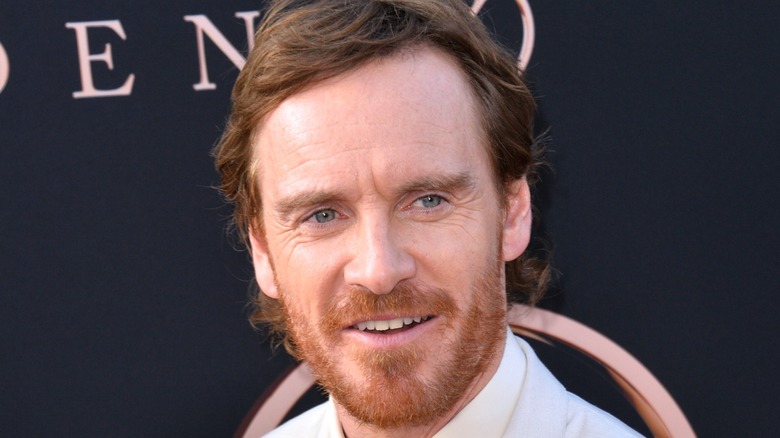 Michael Fassbender smiling on red carpet