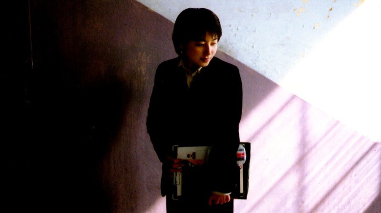 girl carries folder
