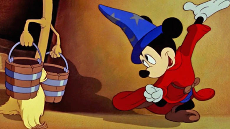 Mickey dances with mop