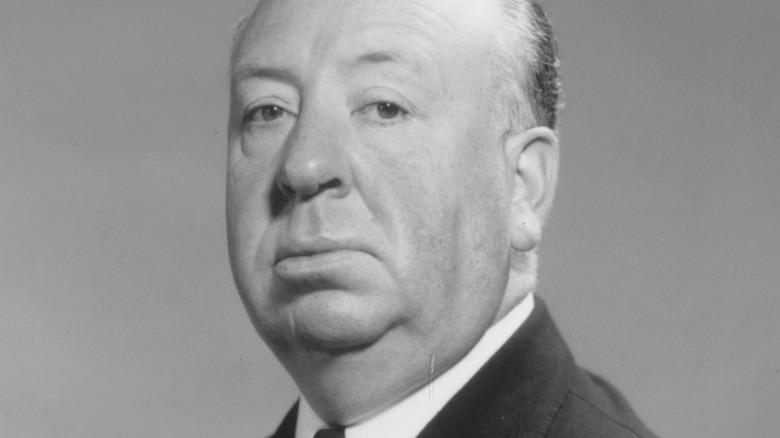 Alfred Hitchcock poses