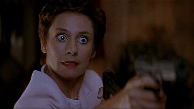 Mrs. Loomis bug-eyed with gun