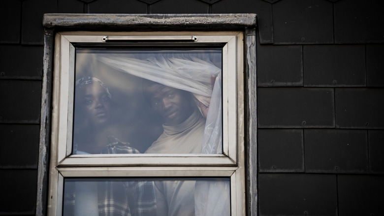 Bol and Rial looking out window