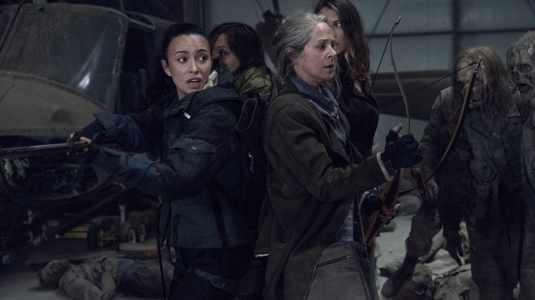 Rosita and Carol fighting walkers