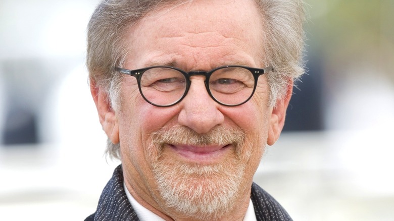 Steven Spielberg smiling for cameras