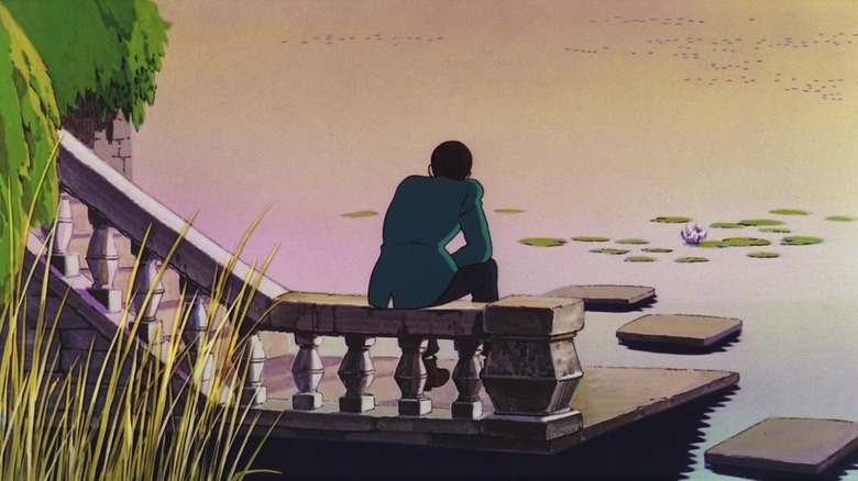 Lupin sitting by a pond