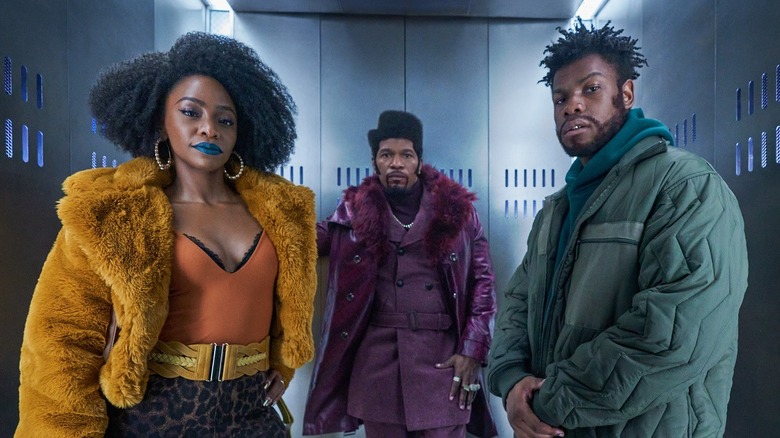 John Boyega, Jamie Foxx, Teyonah Parris in elevator