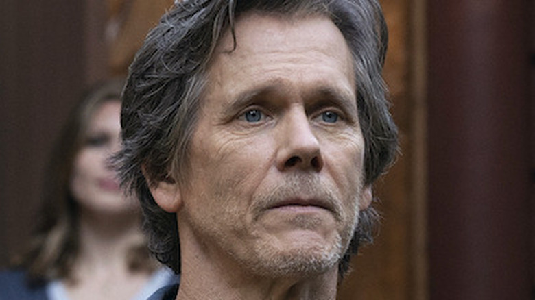 Kevin Bacon looking off camera in They/Them