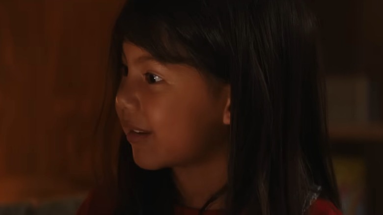 Lilo smiling and lifting her eyebrows