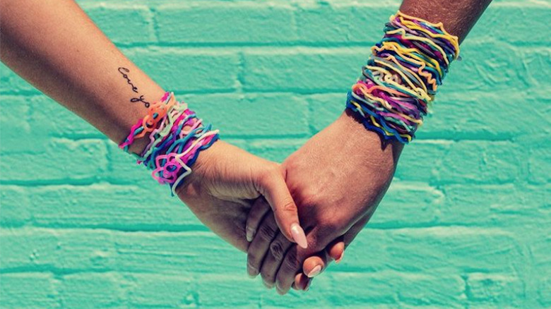 Two people wearing Silly Bandz