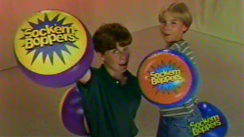 Kids holding up Socker Boppers