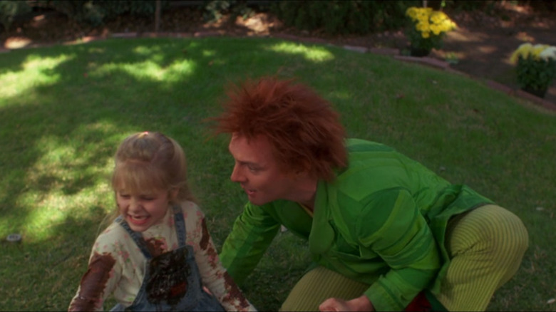 Natalie Bunce laughs while Drop Dead Fred cheers her on