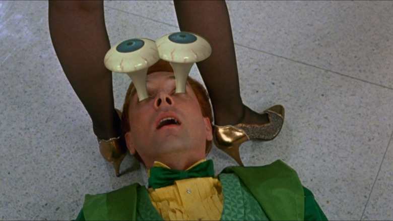 Drop Dead Fred's eyes bug out as he looks up a woman's skirt