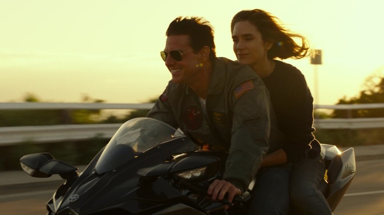 Maverick and Penny ride motorcycle