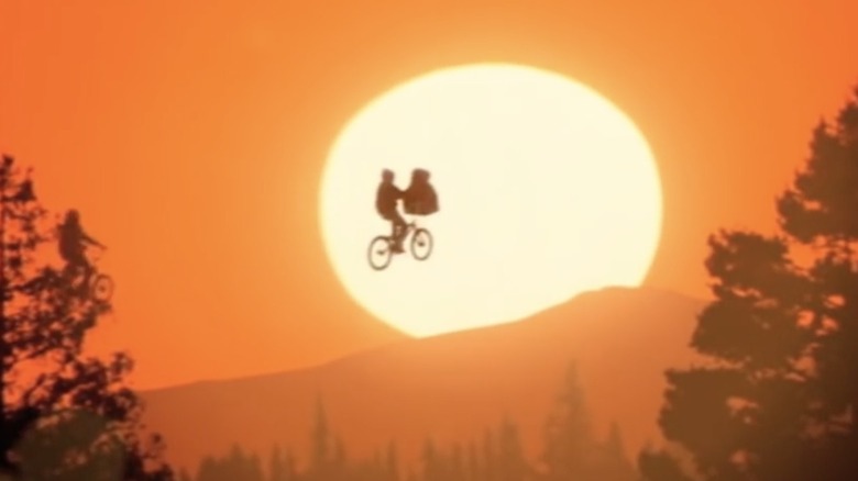 Elliot bikes E.T. past sunset