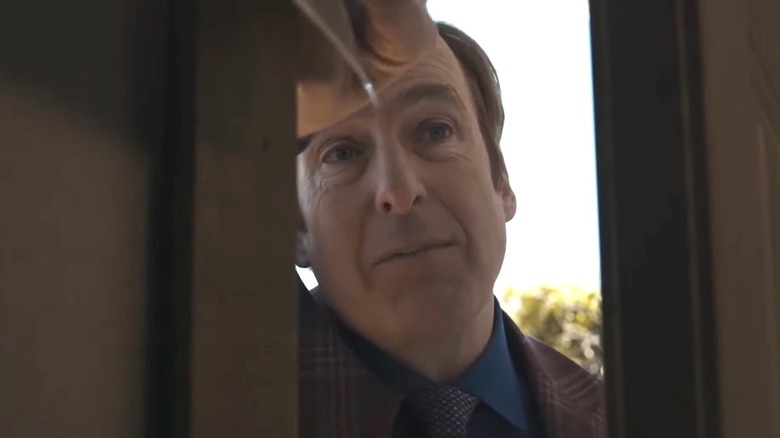 Jimmy trying to force his way into a potential client's house on Better Call Saul
