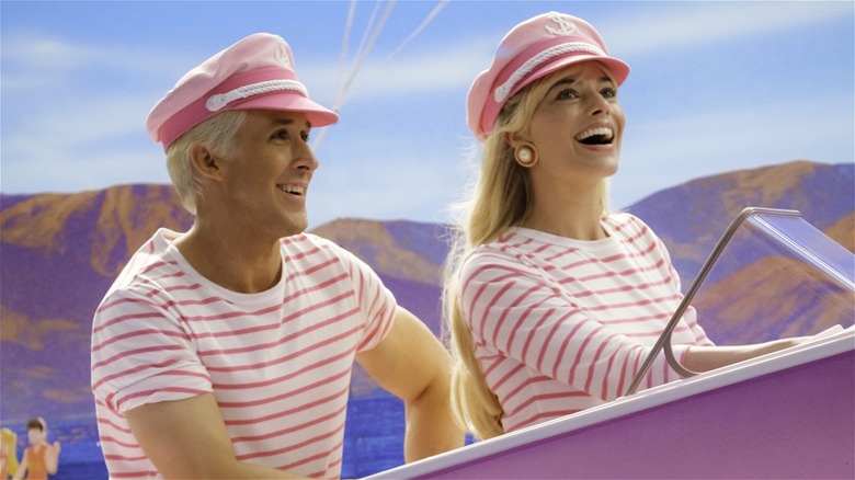 Ken and Barbie riding boat