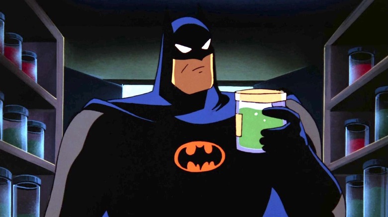 Batman inspects a jar