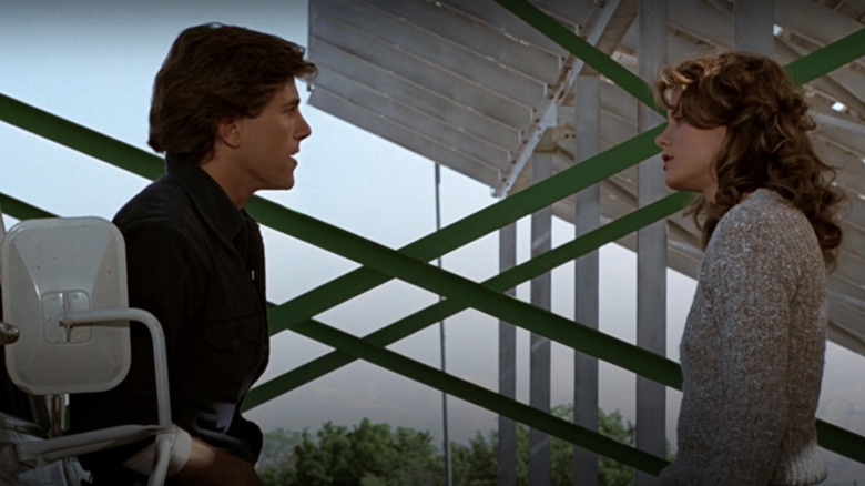 Jim Youngs as Chuck Cranston and Lori Singer as Ariel Moore in Footloose