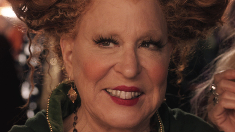 Bette Midler smiles looks to side