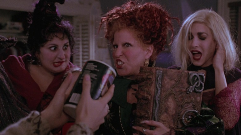 Mary, Winifred, and Sarah Sanderson grab book