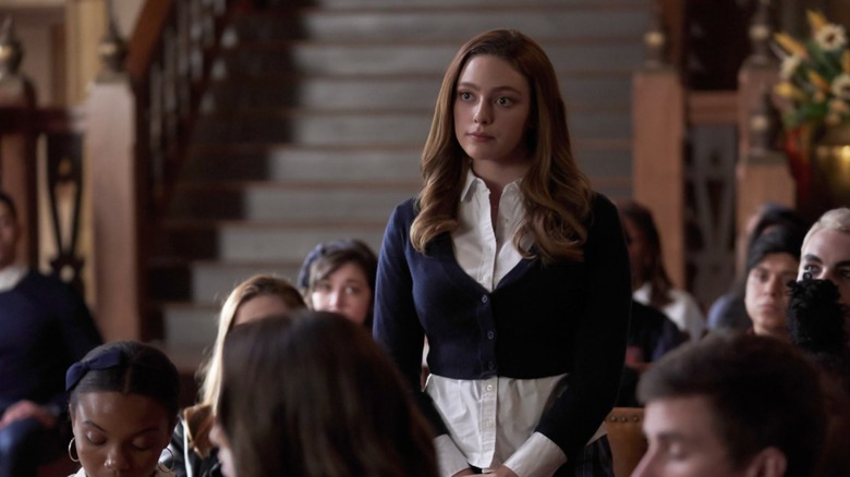 Hope stands during school meeting