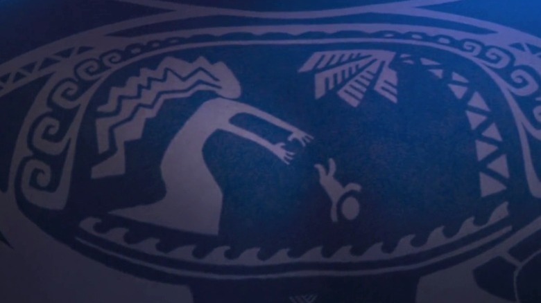 A tattoo depicting Maui's mother throwing him into the sea