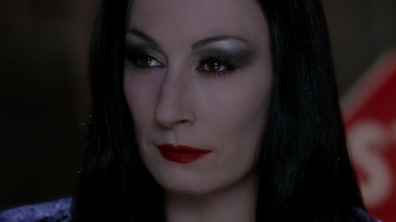 Morticia smirking and glaring