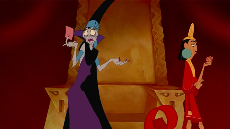 Yzma looking at her pink slip as Kuzco examines his nails