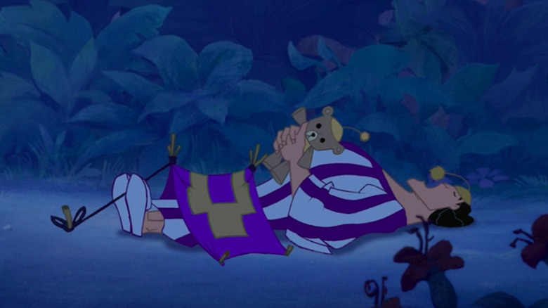 Kronk sleeping under a tiny tent