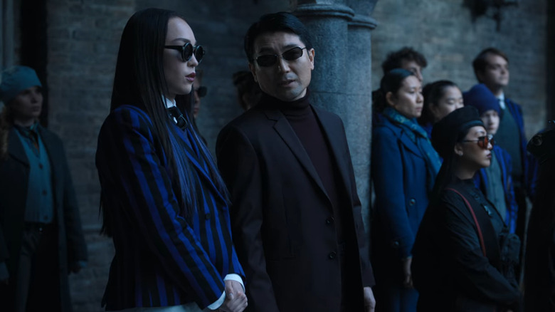 Yoko standing with her father