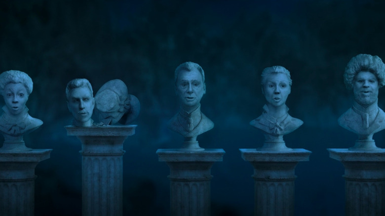 Ghostly busts singing "Grim Grinning Ghosts"